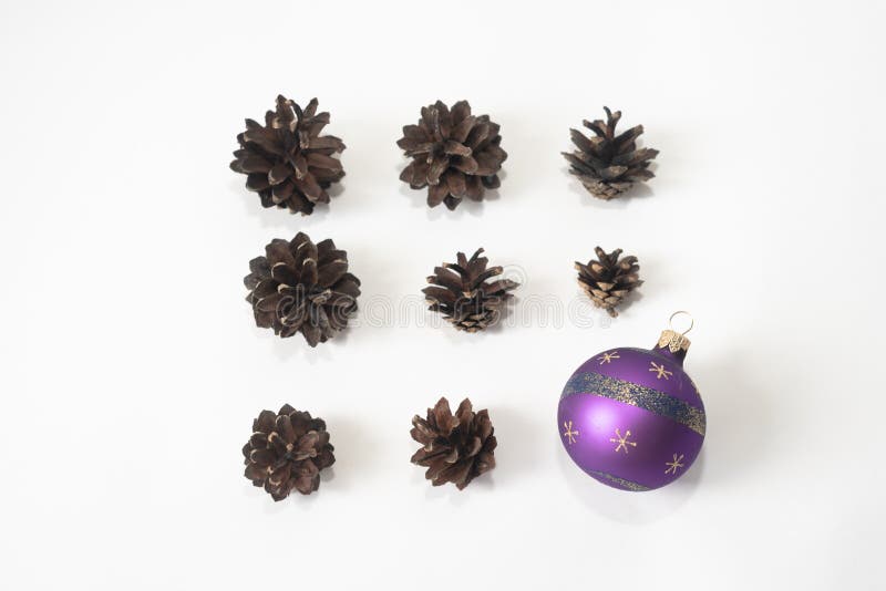 Composition of pine cones with Christmas ball isolated on white background. Holiday new year concept. Mock-up, greeting card, stock photo Composition of pine cones with Christmas ball isolated on white background. Holiday new year concept. Mock-up, greeting card, stock photo