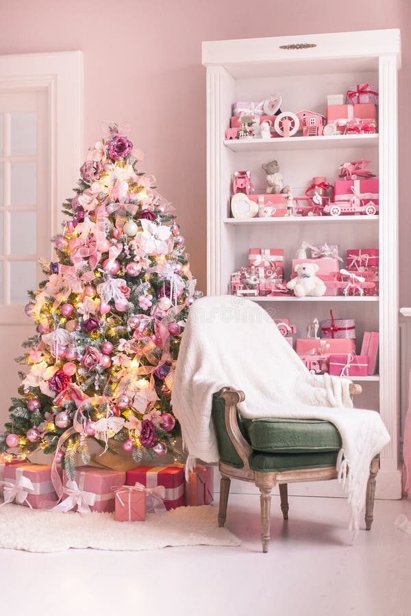 Cozy bright children`s room with Christmas tree, chair and toys. Selective focus. Cozy bright children`s room with Christmas tree, chair and toys. Selective royalty free stock image