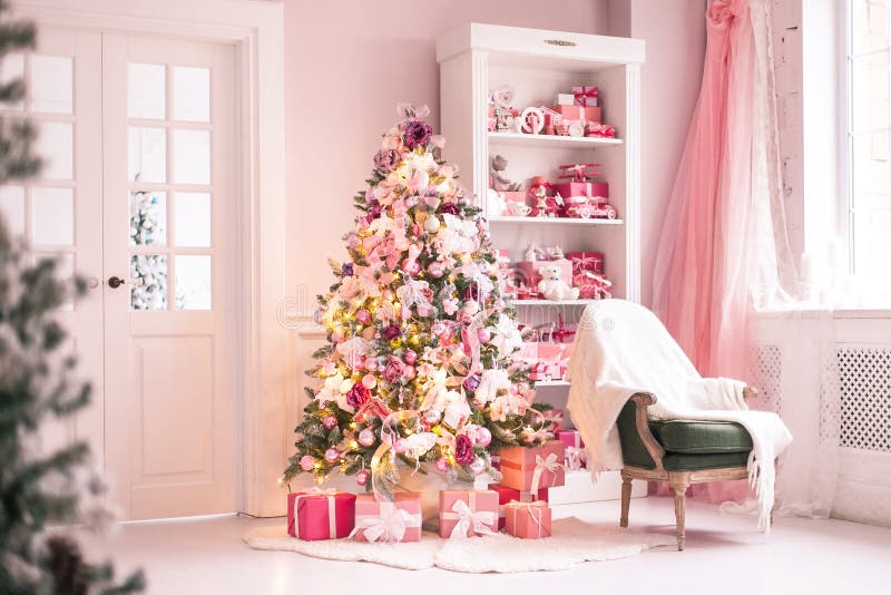 Cozy bright children`s room with Christmas tree, chair and toys. Selective focus. Cozy bright children`s room with Christmas tree, chair and toys. Selective stock photos