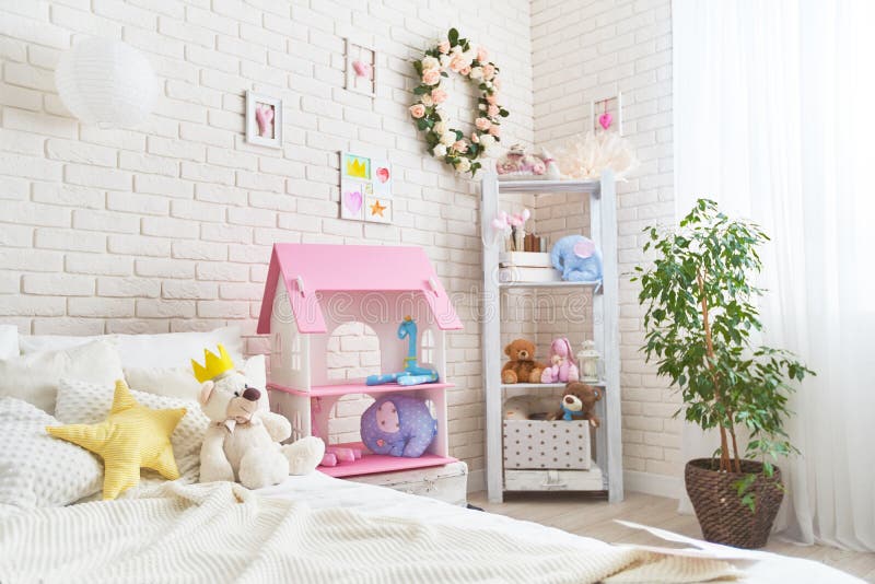 Cozy children room for little girl, with white wall with pictures, Dollhouse. Cozy children`s room for a little girl, with a white wall with pictures, a royalty free stock images