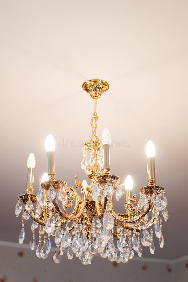 Crystal chandelier. Beautiful crystal chandelier in a room stock photo