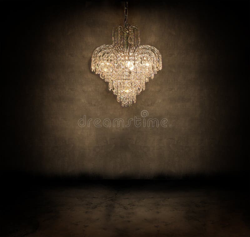 Crystal chandelier. Hanging in a dark grungy room royalty free stock photos