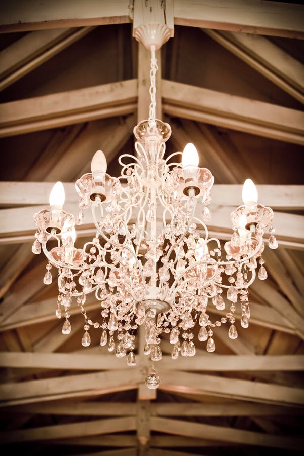 Crystal Chandelier. Beautiful crystal chandelier at an antique/vintage style wedding venue stock images