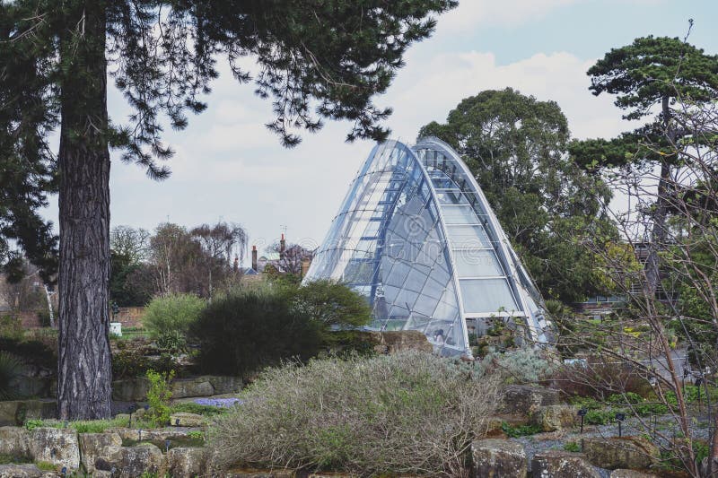 Davies Alpine House, modern building designed to provide perfect condition for alpine plants, located in Kew Gardens, London, UK. London, UK - April 2018: Davies stock photos