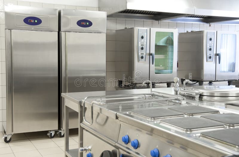 Empty restaurant kitchen with professional equipment stock image