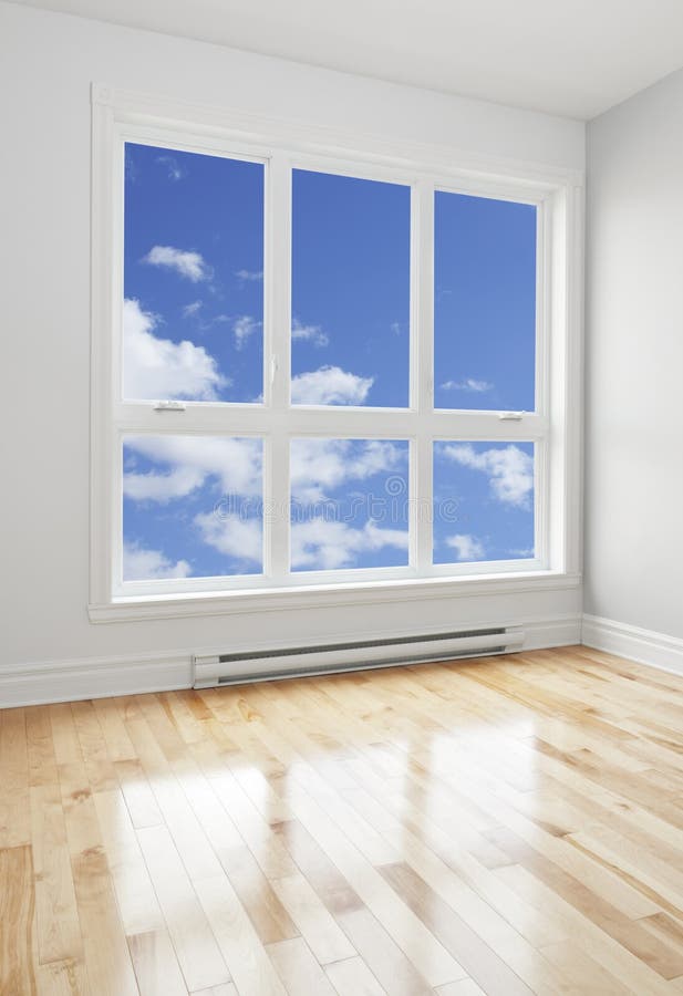 Empty room and blue sky seen through the window royalty free stock images