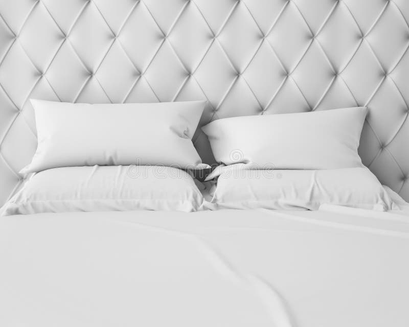 Empty white bed and pillows with luxury headboard royalty free stock image