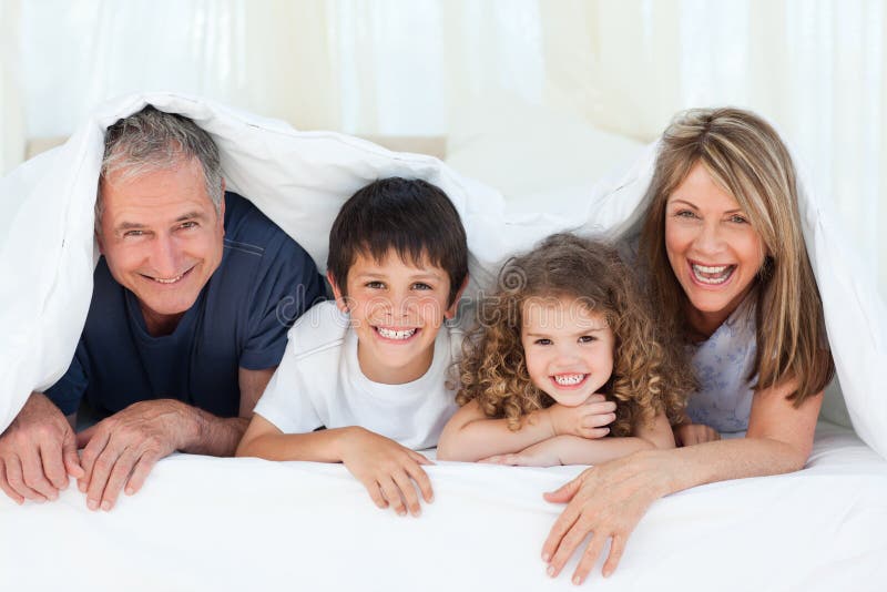 Family in their bedroom at home stock image