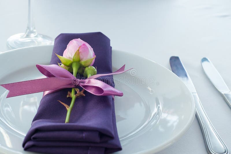 Festive table setting in the restaurant with flowers. royalty free stock images