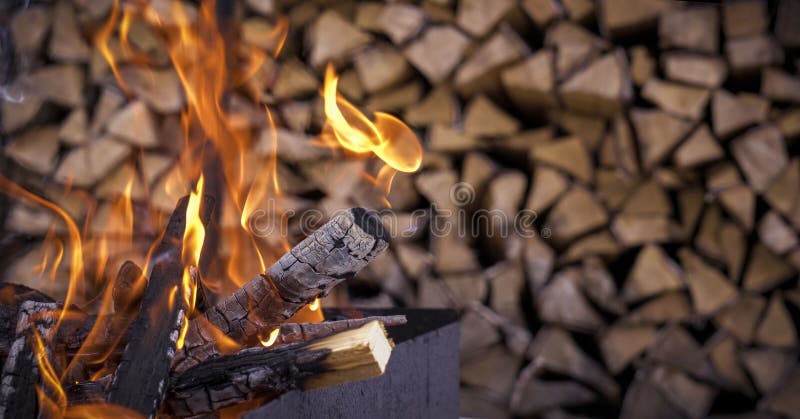 The fire on the background of firewood. Nice fire stock images