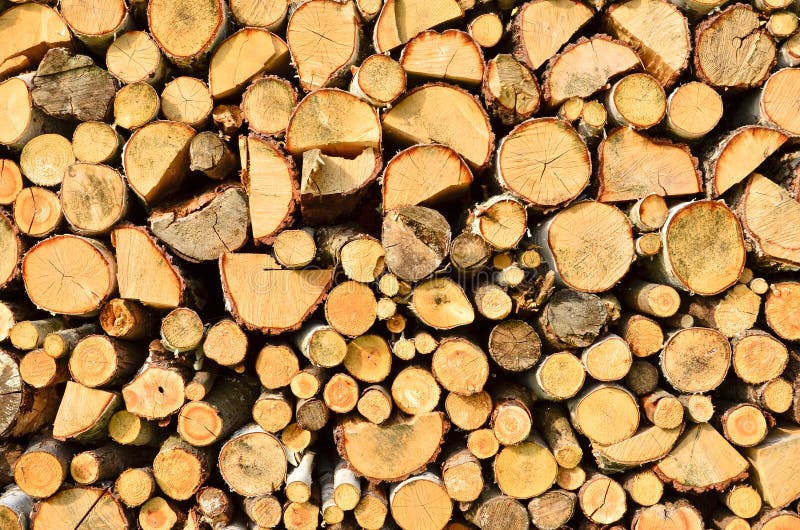 Firewood background. Pile of cut firewood - photo can be used as a background stock image