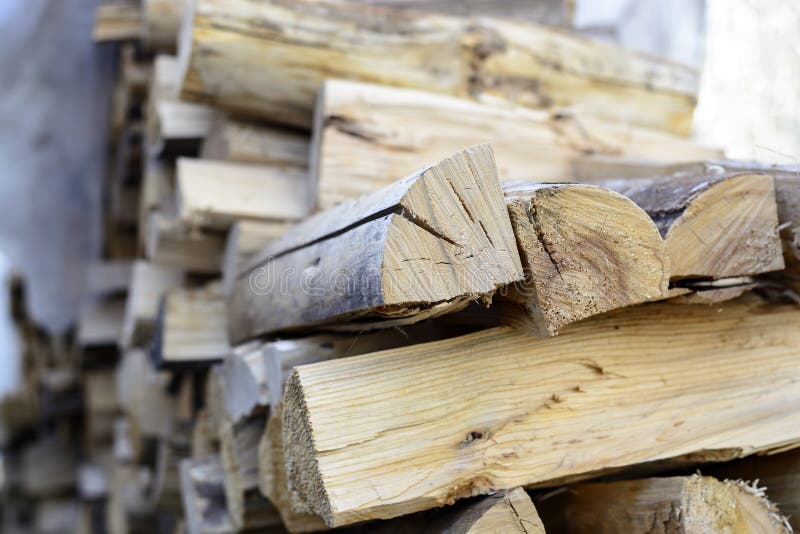 Firewood background - split hardwood kiln-dried. split firewood in the stack. Firewood background - split hardwood kiln-dried. split firewood in the stack stock photos