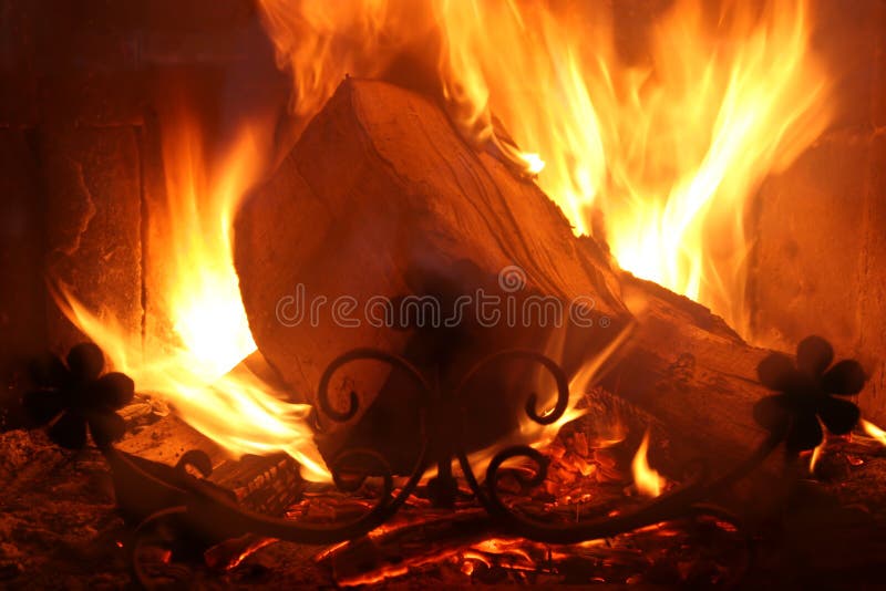 Firewood blaze in furnace. Details of firewood blaze in furnace stock photo