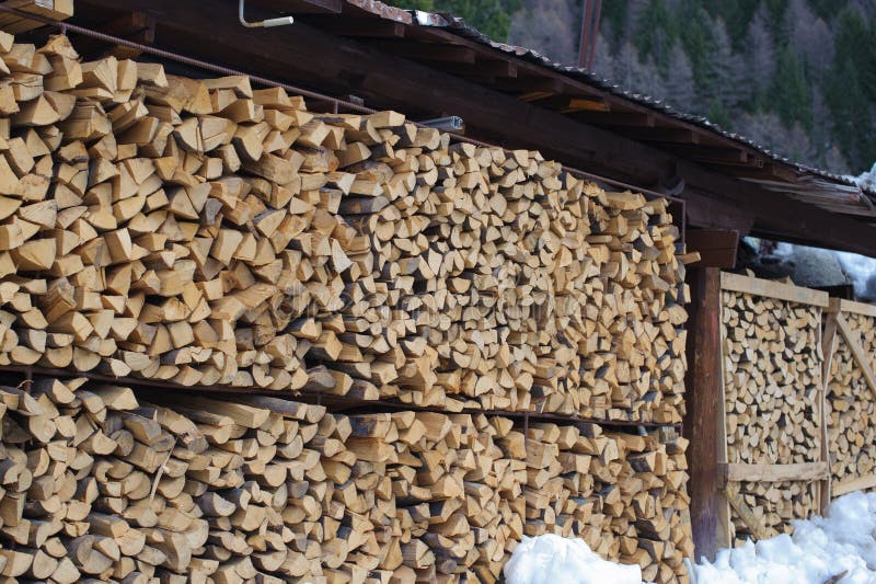 Firewood. Huge stack storage of firewood stock photo