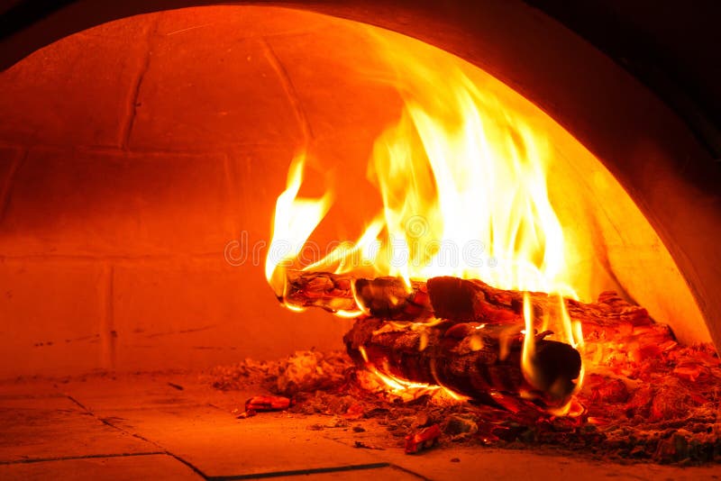 Firewood oven for bake pizza. Close up firewood oven with flame ready for bake pizza royalty free stock images