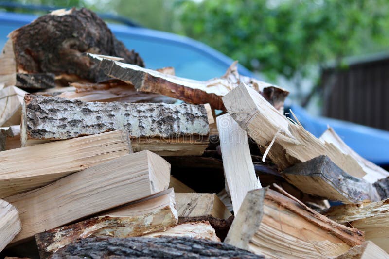 Firewood. A pile of firewood with car on background stock photography