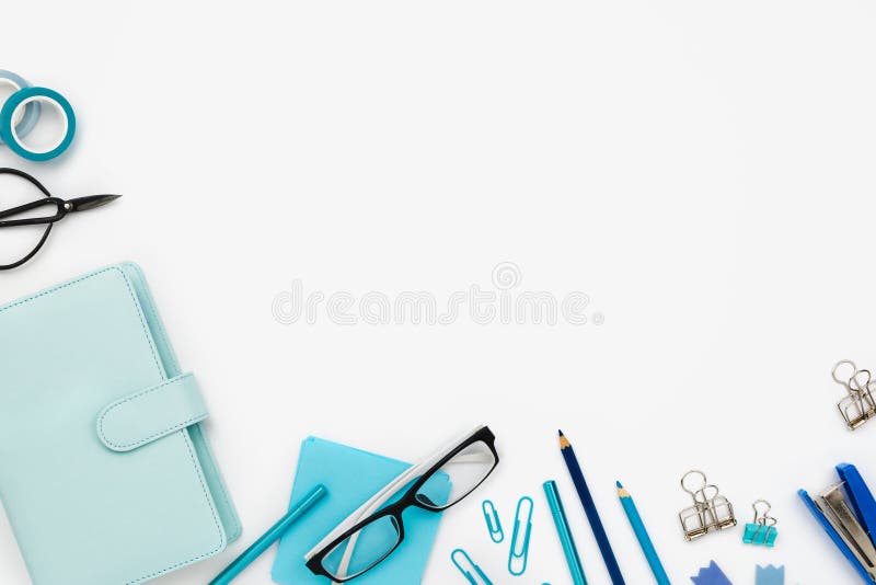 Flatlay arrangement with various office and stationary tools on white. Planner, note paper, pens, pencilc etc. Copyspace stock photography