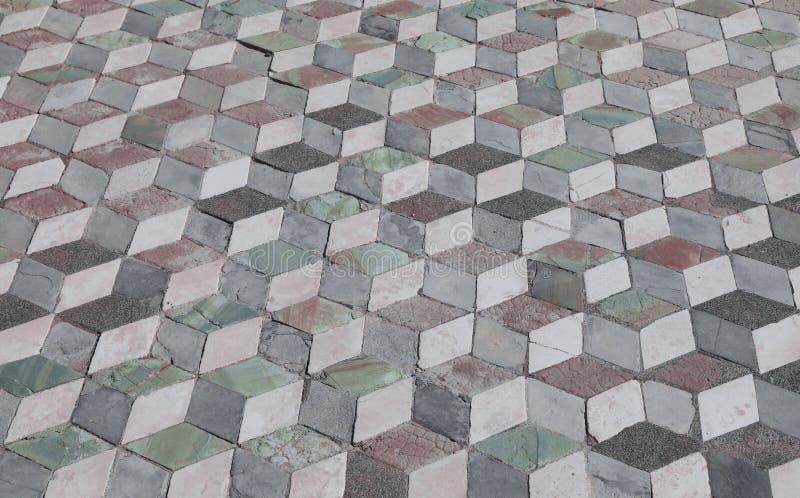Floor with tiles that create an optical effect of superimposed c. Strange floor with tiles that create an optical effect of cubes superimposed on each other stock photos