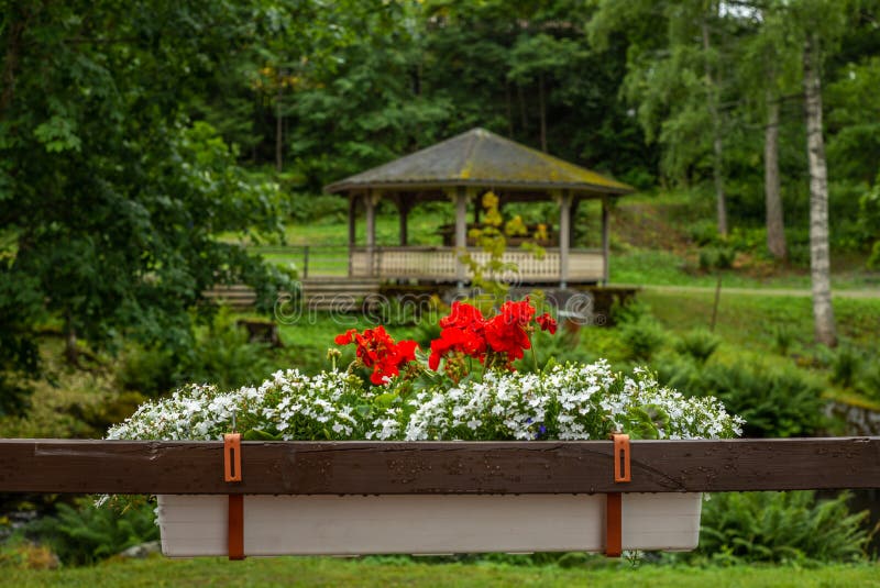 Flowers and gazebo s in a park in Enonkoski in Finland in summer - 1. Flowers and gazebo s in a park in Enonkoski in Finland in summer stock photos