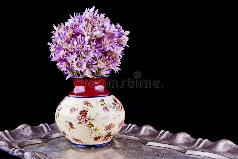 Flowers in a vase. Beautiful colorful bouquet of flowers in an old vase royalty free stock image