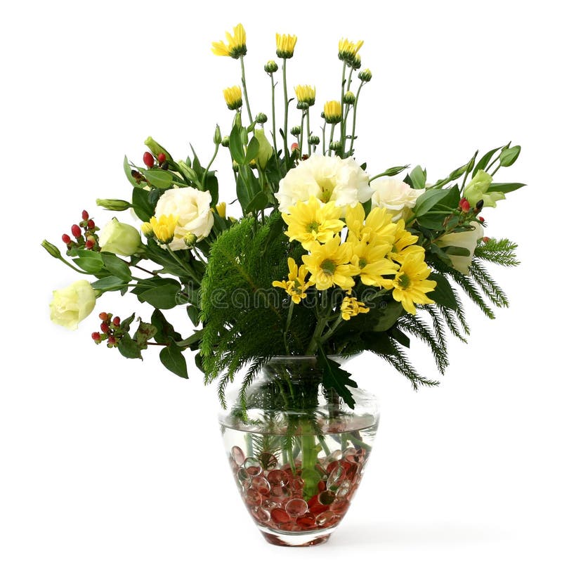 Flowers in vase. Assorted flowers and buds with plenty of green in a transparent glass vase with pink beads stock photos