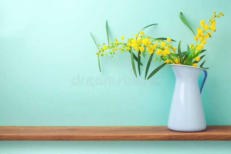 Flowers in vase on wooden shelf. With copy space stock photo