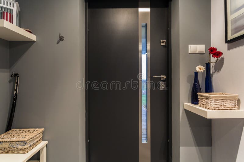 Front door. Modern black front door to new luxury house stock image