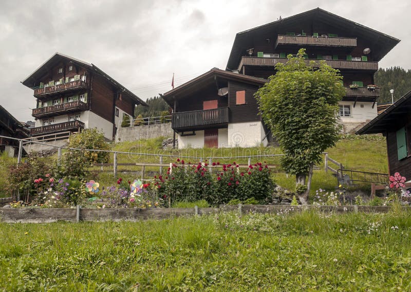Garden of Murren. In the swiss Alps, in a valley with rural houses, on a cloudy day royalty free stock photography