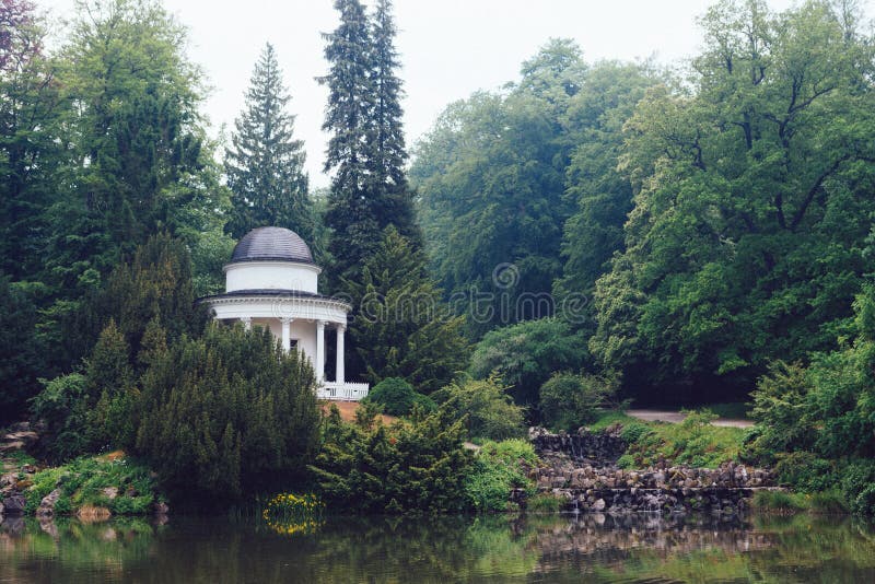 Gazebo in the green park at summer stock photography