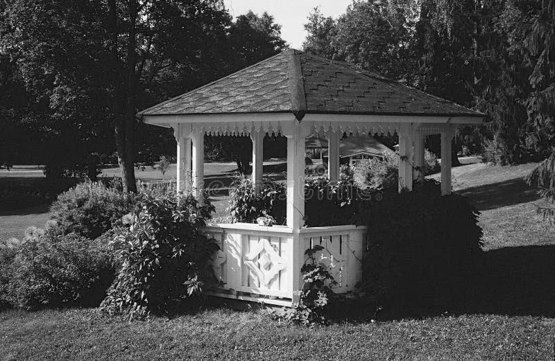 Gazebo and tables in a park in Finland in summer  shot with analogue film photography - 2. Gazebo and tables in a park in Finland in summer  shot with analogue royalty free stock image