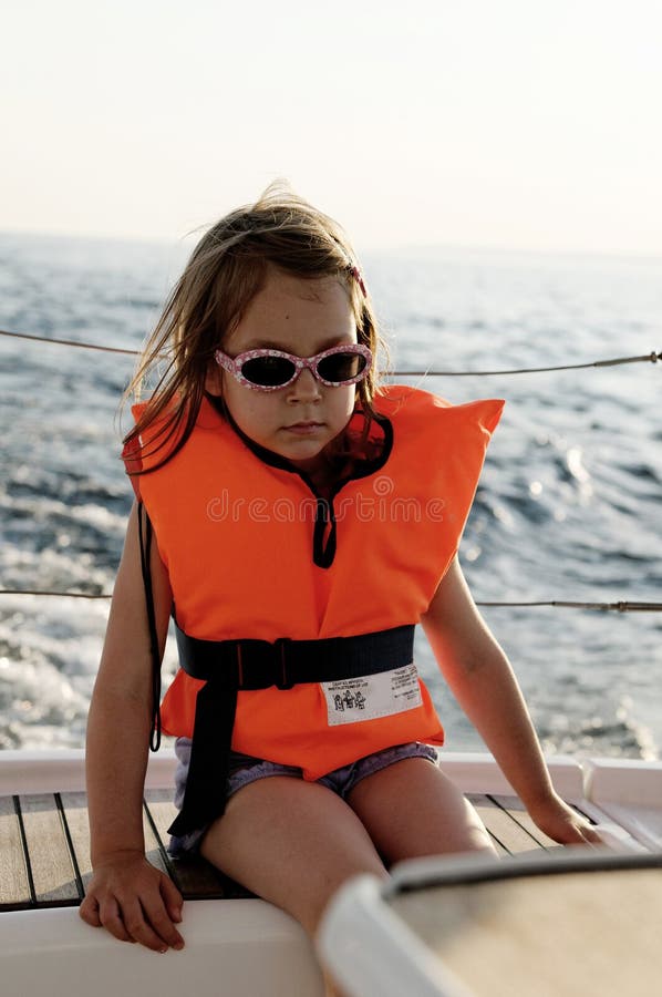 Girl wearing life jacket stock photo