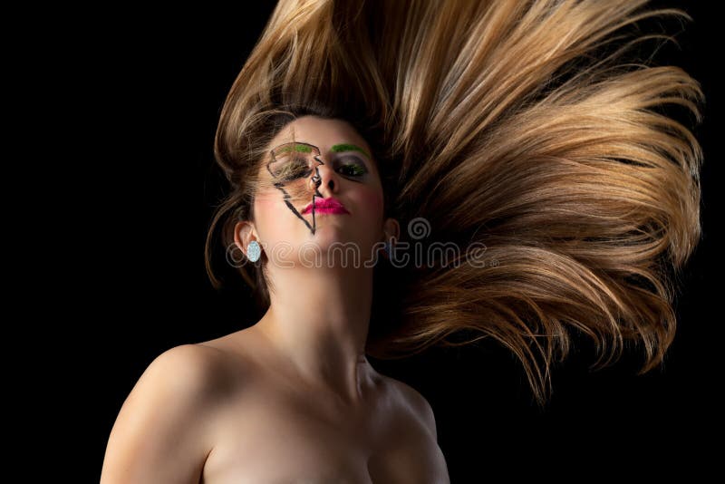 Girl Wearing Lightning Makeup Long Flowing Hair. Girl With Lightning Makeup Long Flowing Hair royalty free stock photo