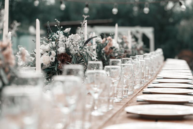 Glasses on the festive table setting. Wedding table decor concept. Table setting in classic style, setout. fine art. stock photo