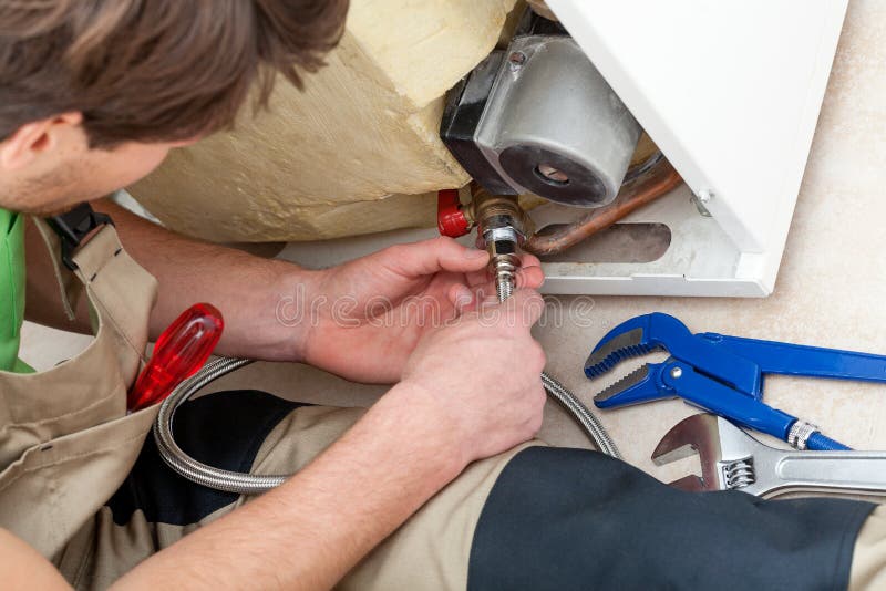 Handyman with tools repairing an equipment royalty free stock photos