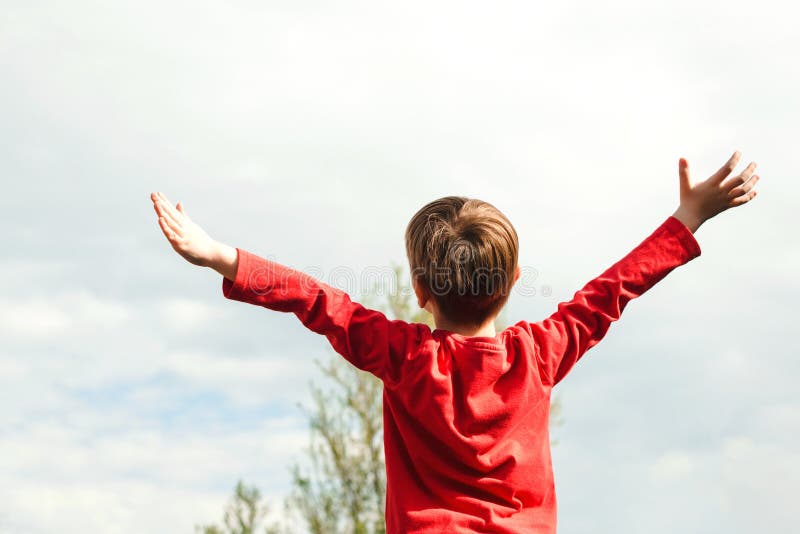 Happy child raising hands up at nature. Health, freedom and future concept. Happy childhood. Fresh air, environment. Dream of. Flying. Little boy enjoying sunny royalty free stock photos