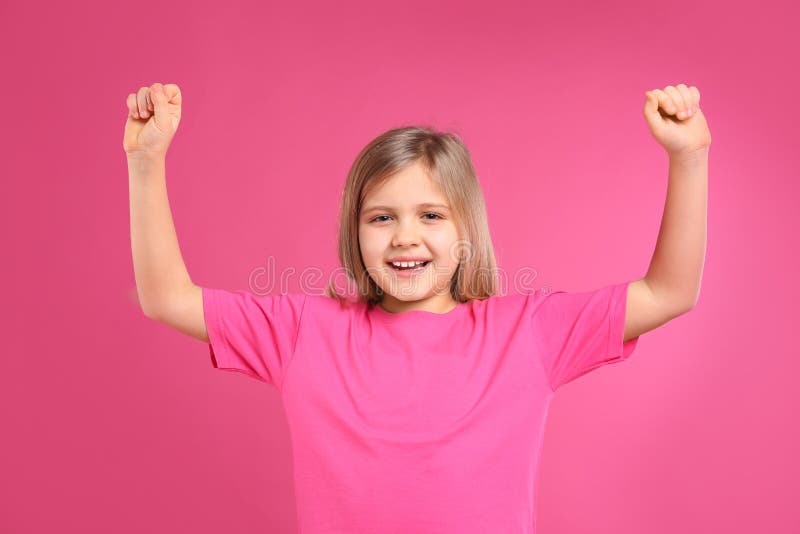 Happy little girl wearing casual outfit on background royalty free stock photo
