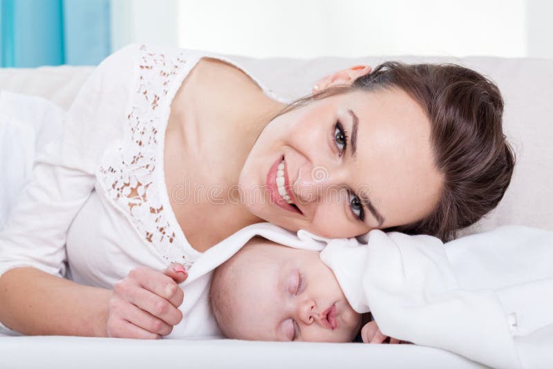 Happy young mother and little baby stock images
