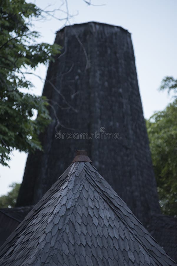 House with unique roof-tip. Woodplank stock photo