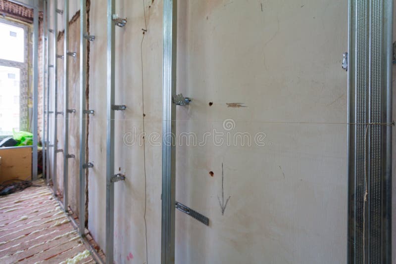 Interior of apartment with materials during on the renovation and construction. Making wall from drywall stock images