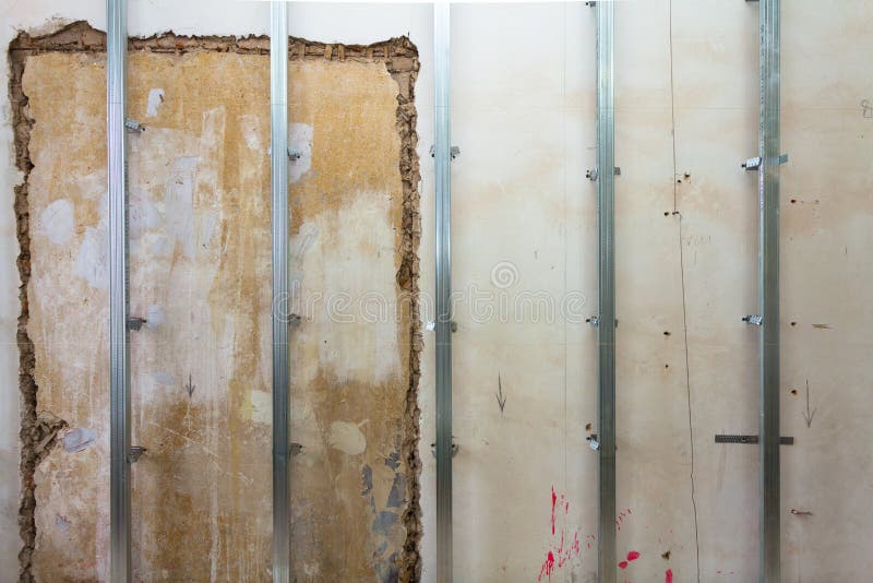Interior of apartment with materials during on the renovation and construction. Making wall from drywall royalty free stock photos