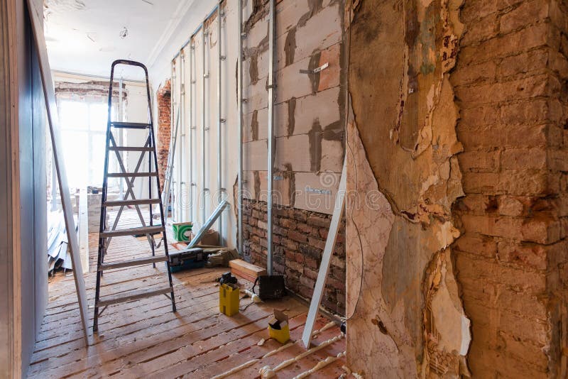 Interior of apartment with materials during on the renovation making wall from gypsum plasterboard. Interior of apartment with materials during on the renovation royalty free stock photo