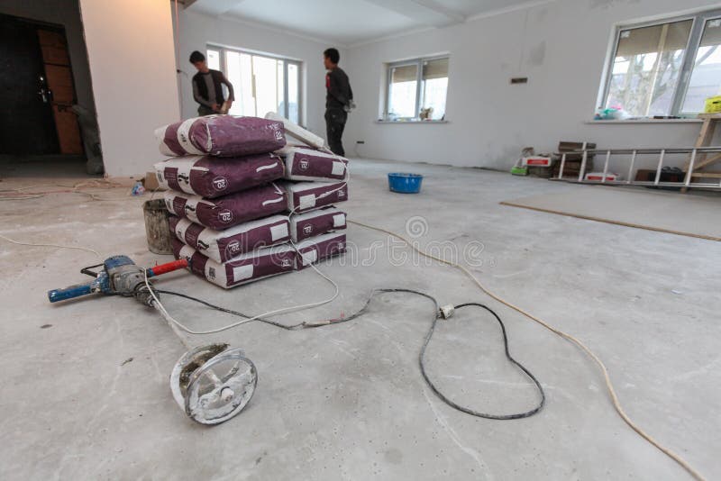 Interior of apartment with materials during on the renovation making wall from gypsum plasterboard. Interior of apartment with materials during on the renovation royalty free stock photo