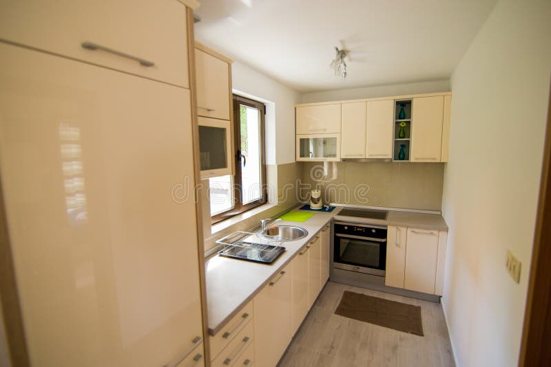 Interior of a large kitchen. In the apartment stock images