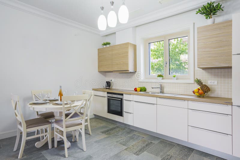 Interior of light spacious kitchen. With large panoramic windows in a luxury villa royalty free stock images