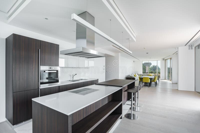 Interior of light spacious kitchen. With large panoramic windows in a luxury villa stock photography