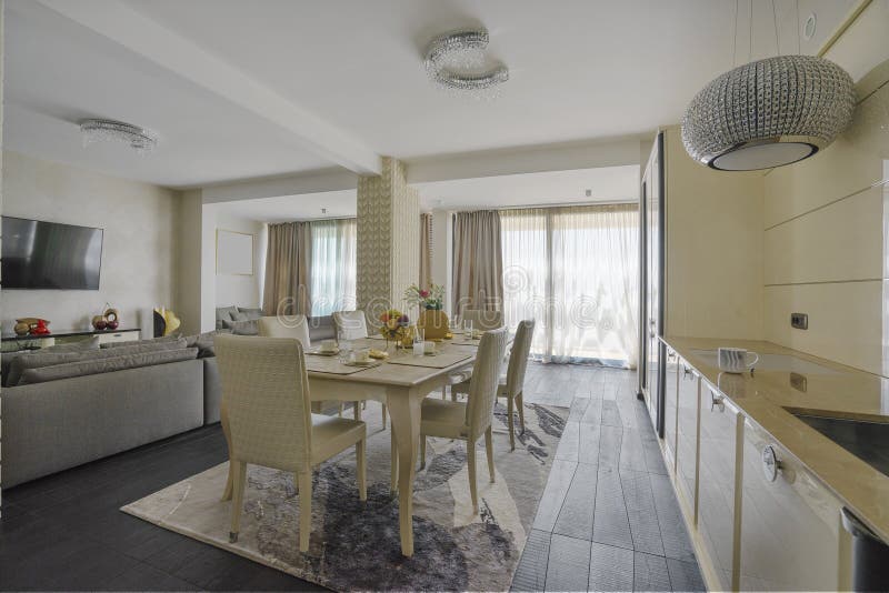 Interior of light spacious kitchen. With large panoramic windows in a luxury villa stock images