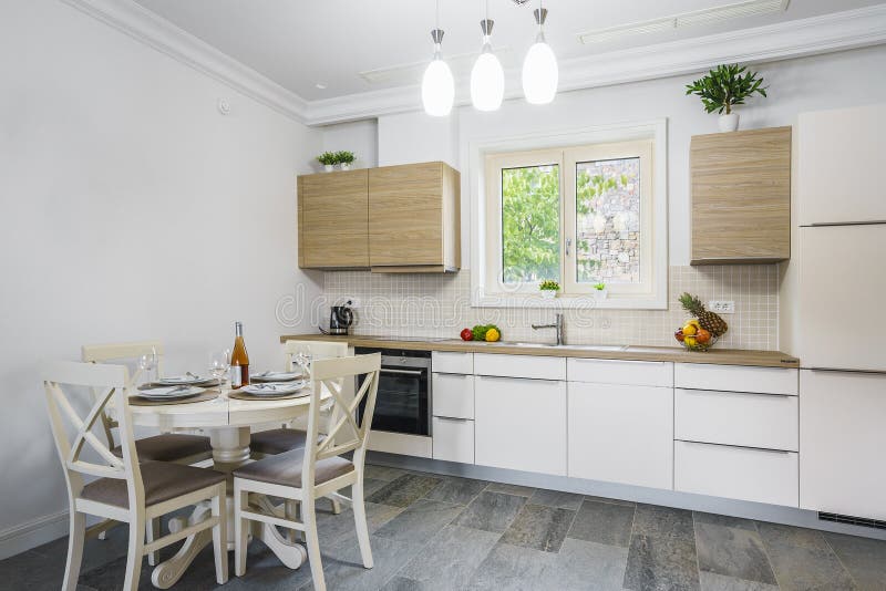 Interior of light spacious kitchen. With large panoramic windows in a luxury villa stock images