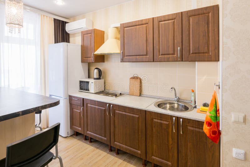 Interior of modern spacious inexpensive kitchen. Interior of a modern spacious inexpensive kitchen royalty free stock photos