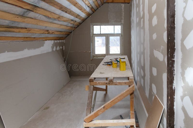 Interior of room apartment with new window and materials home-made scaffold, tools, level during on the renovation, overhaul and. Construction remodeling and stock image