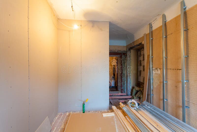 Interior of upgrade apartment with materials during on the remodeling, renovation, extension, restoration. Reconstruction and construction. making wall from royalty free stock images